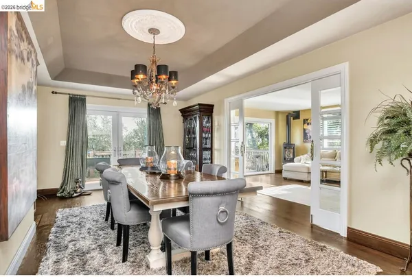 a kitchen with stainless steel appliances granite countertop a sink a stove and refrigerator