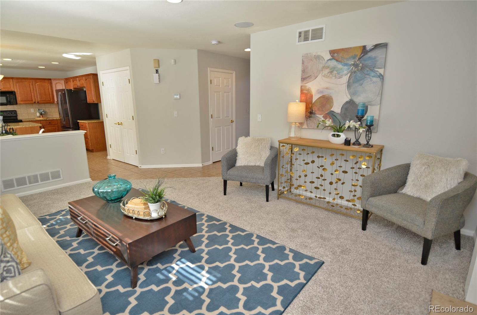 10699 Wynspire Way Highlands Ranch, CO 80130 - Photo 12 of 40 a living room with furniture and wooden floor