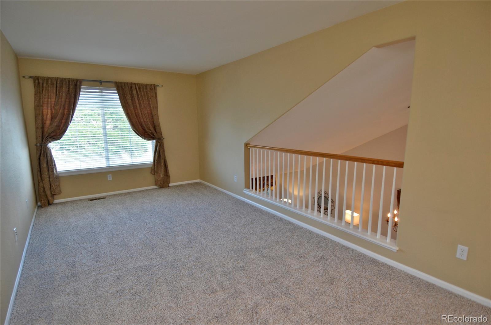 10699 Wynspire Way Highlands Ranch, CO 80130 - Photo 22 of 40 a view of an empty room with a window