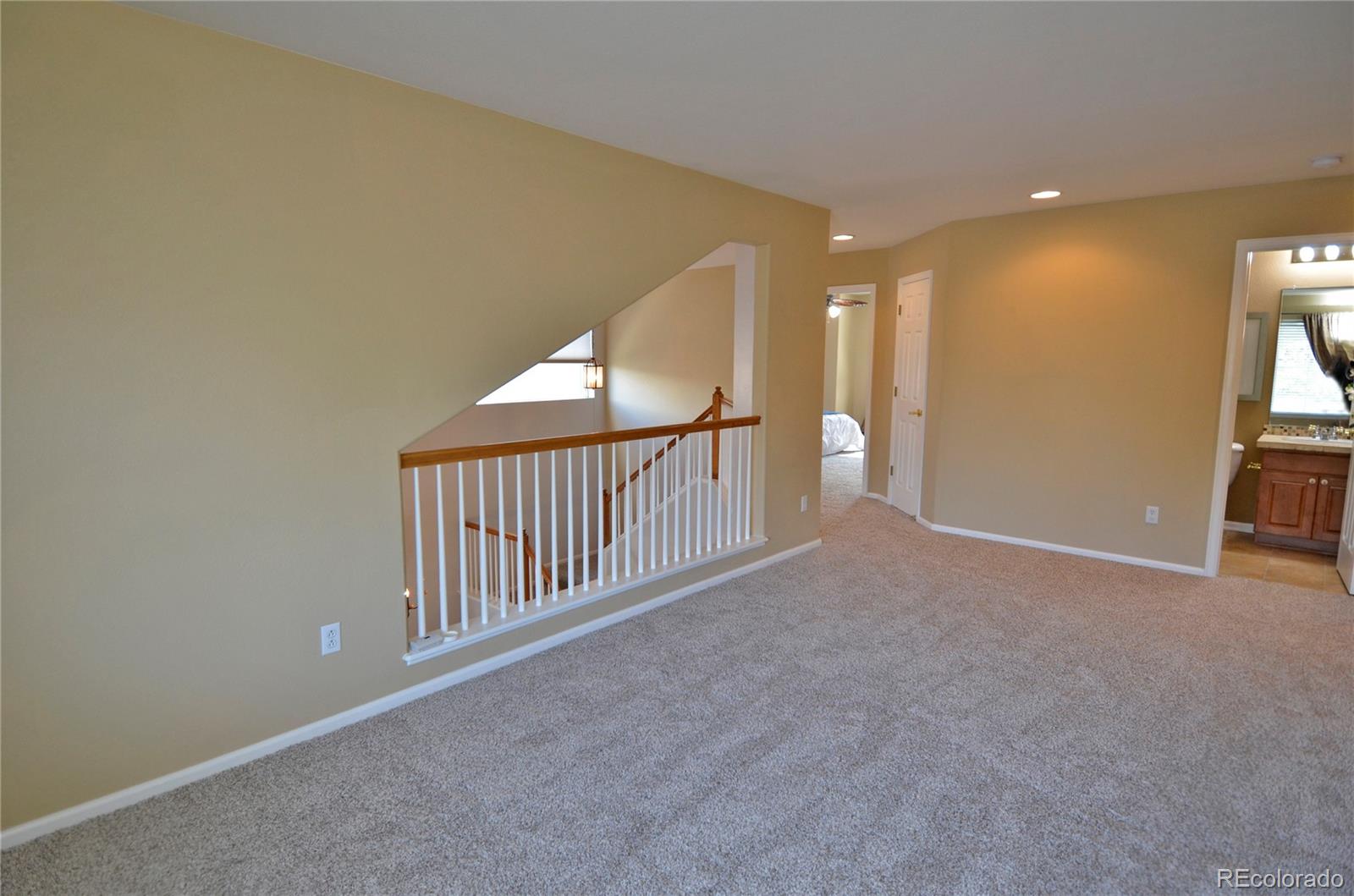 10699 Wynspire Way Highlands Ranch, CO 80130 - Photo 23 of 40 a view of an entryway with wooden floor