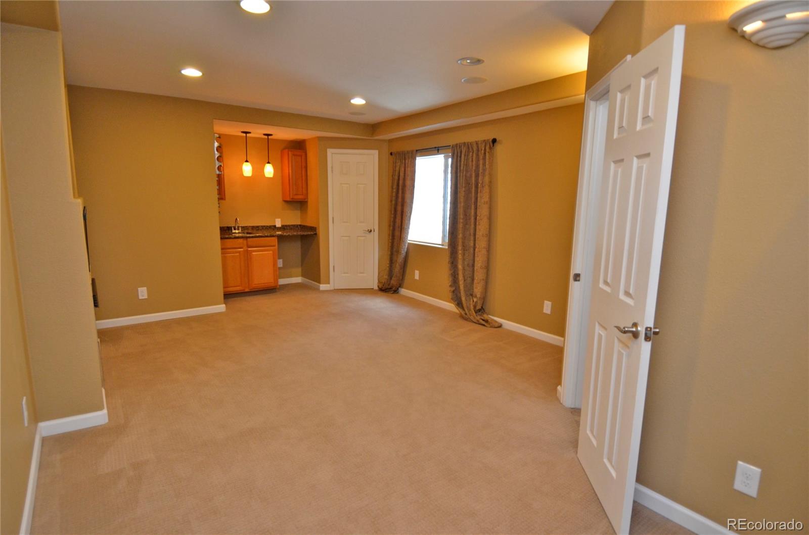 10699 Wynspire Way Highlands Ranch, CO 80130 - Photo 33 of 40 a view of an empty room with a window