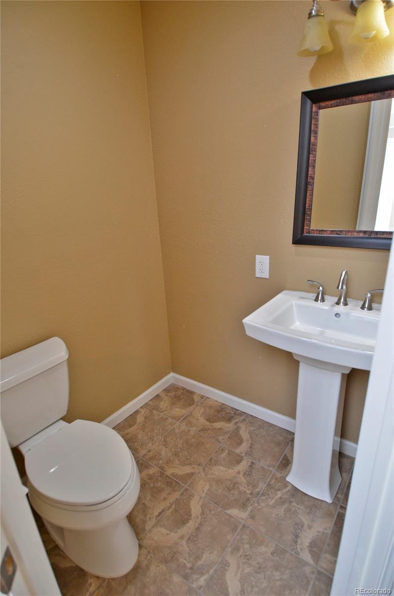 10699 Wynspire Way Highlands Ranch, CO 80130 - Photo 38 of 40 a bathroom with a sink and a toilet