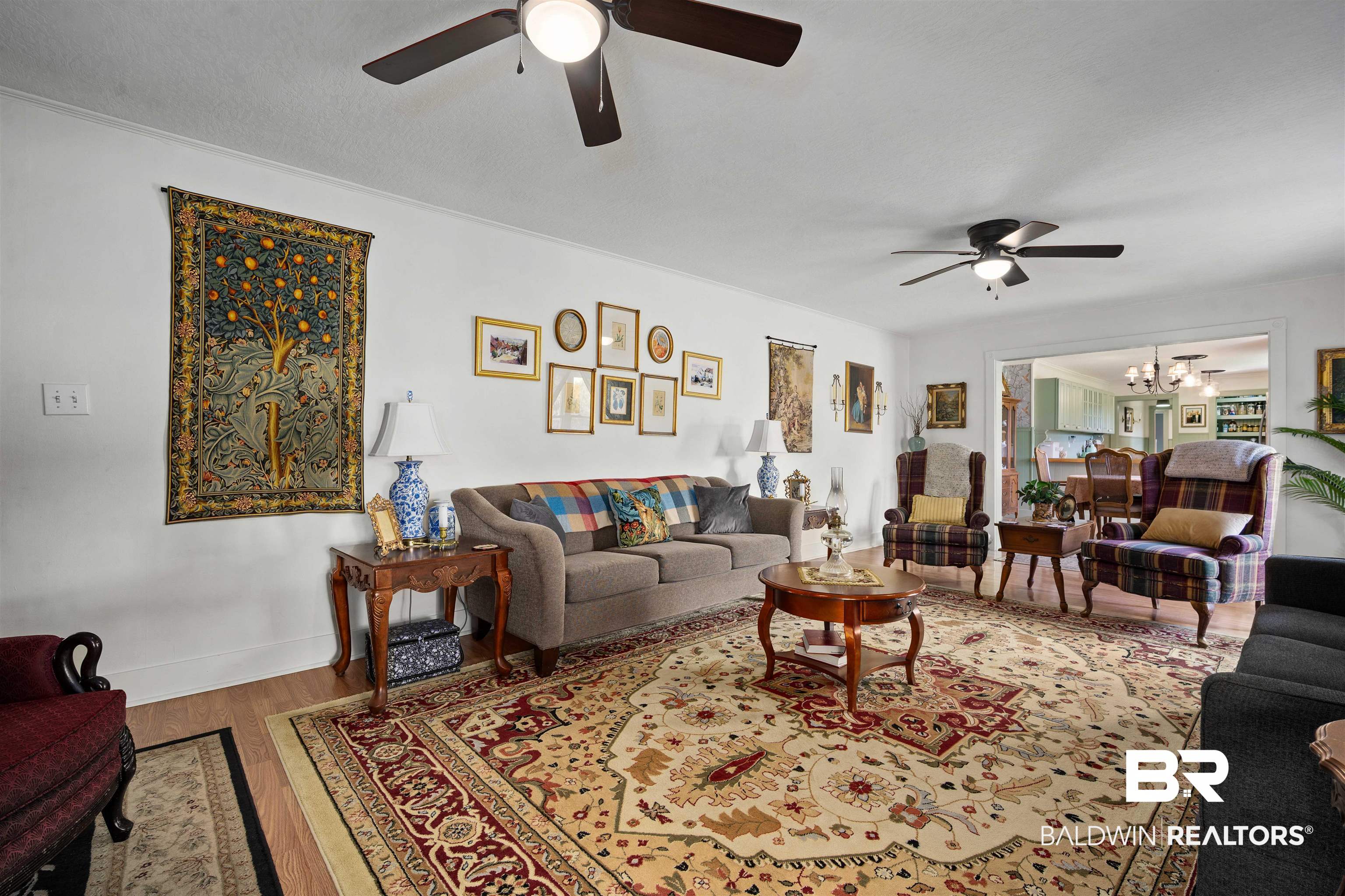 22 Horace Odom Road Millry, AL 36558 - Photo 7 of 39 Living area with a chandelier, ceiling fan, and wood finished floors