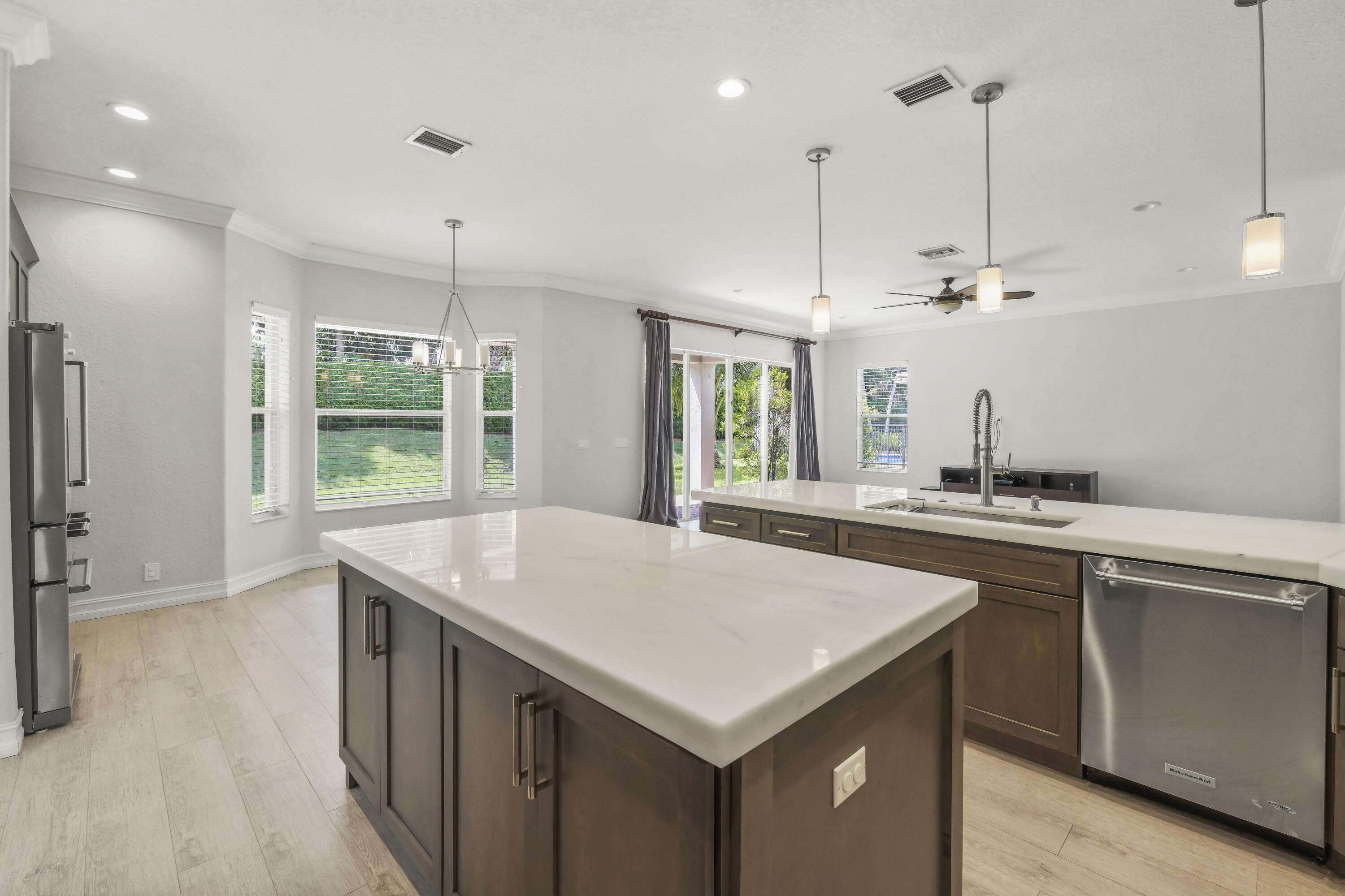 8620 Cobblestone Point Circle Boynton Beach, FL 33472 - Photo 11 of 42 a kitchen with a stove a refrigerator a sink and chairs