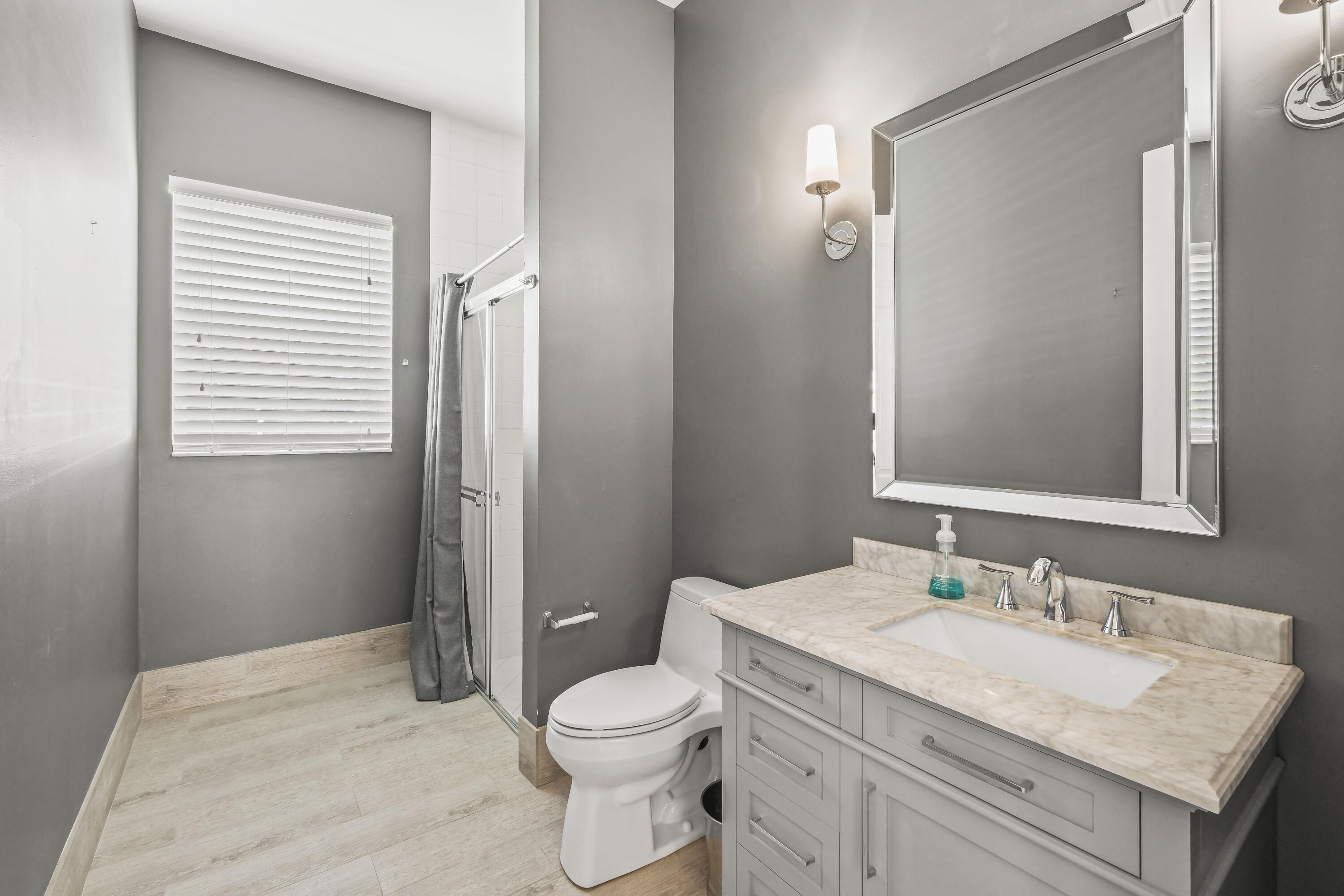 8620 Cobblestone Point Circle Boynton Beach, FL 33472 - Photo 12 of 42 a bathroom with a granite countertop sink toilet and shower