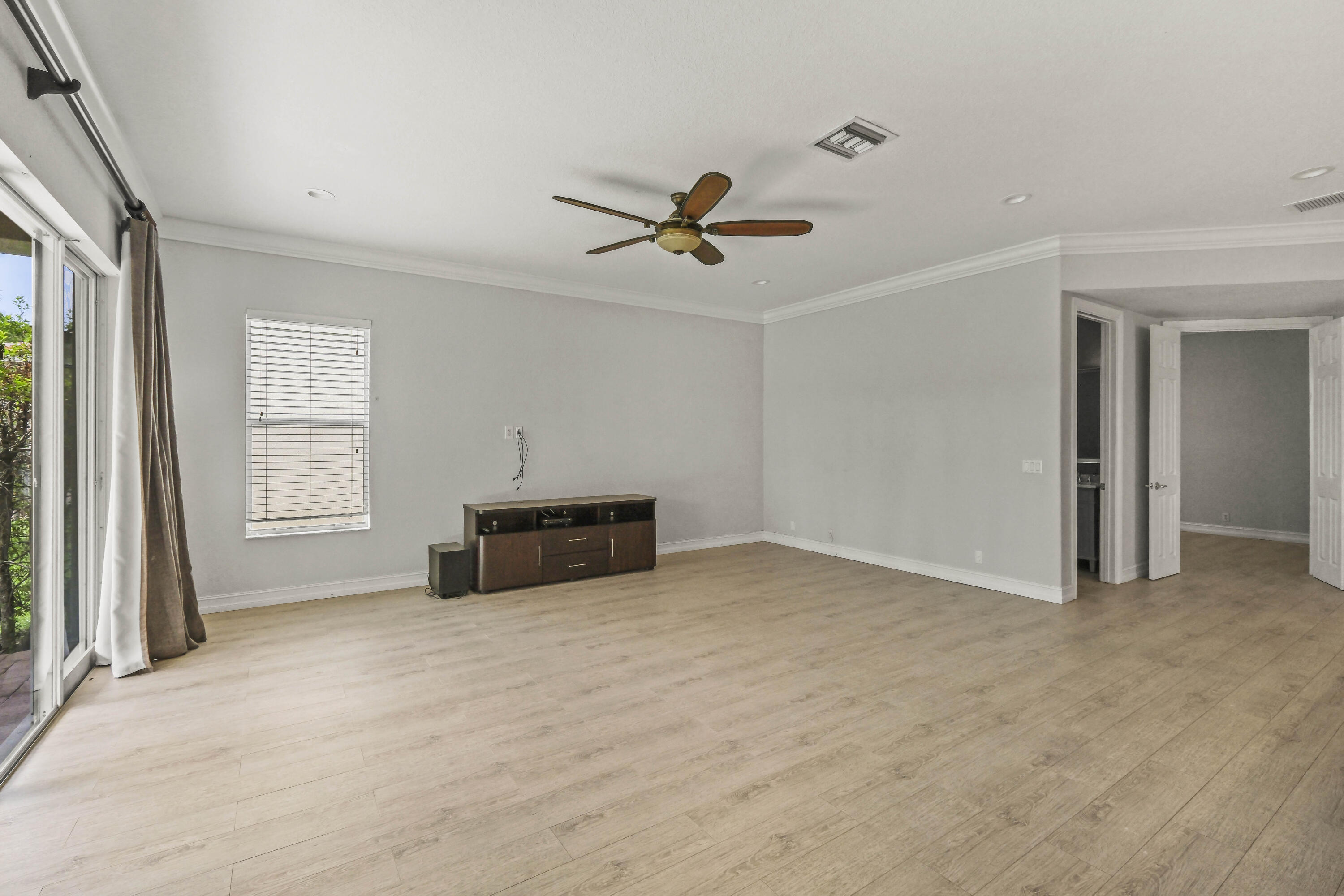 8620 Cobblestone Point Circle Boynton Beach, FL 33472 - Photo 15 of 42 an empty room with windows and fan