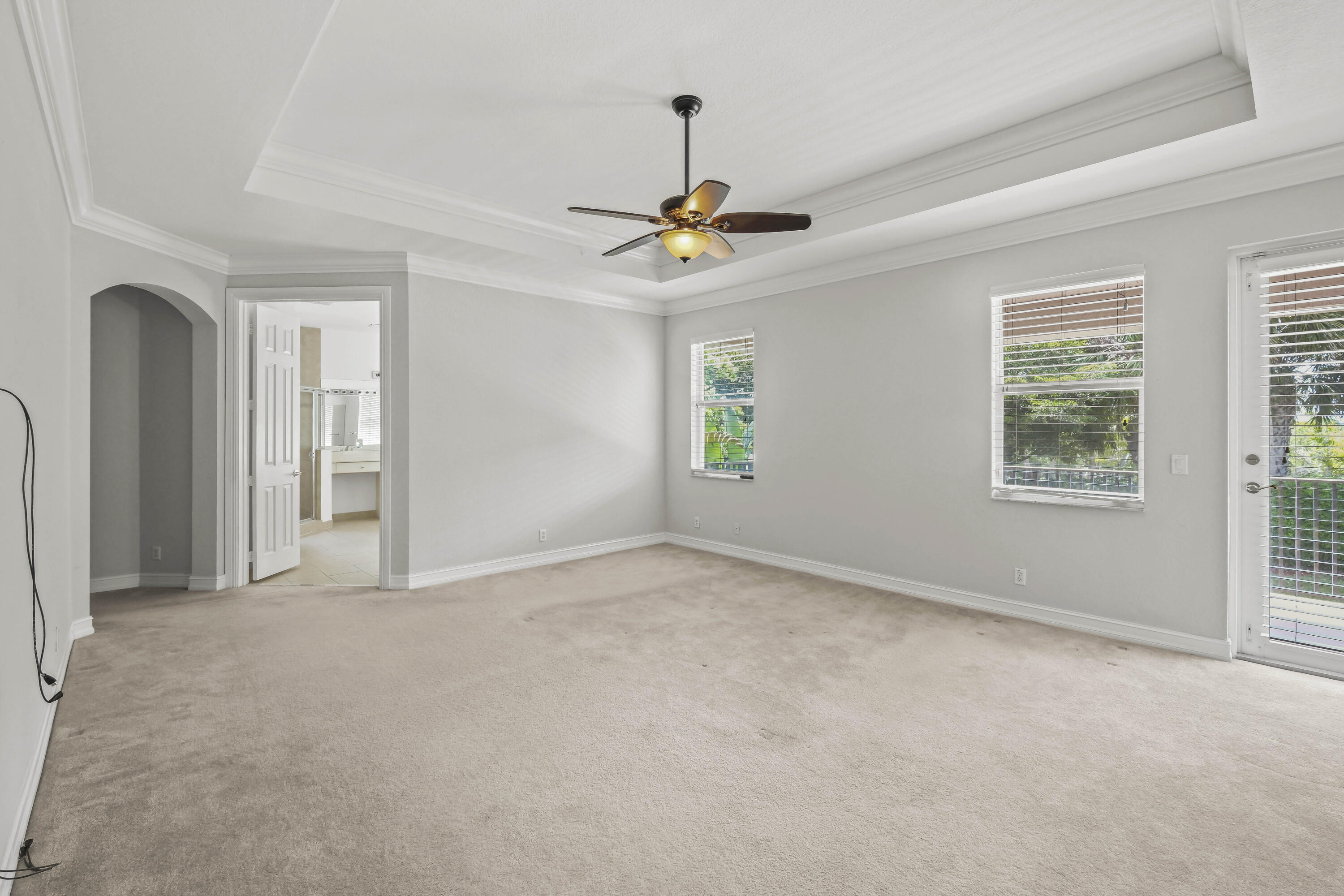 8620 Cobblestone Point Circle Boynton Beach, FL 33472 - Photo 19 of 42 an empty room with windows and fan