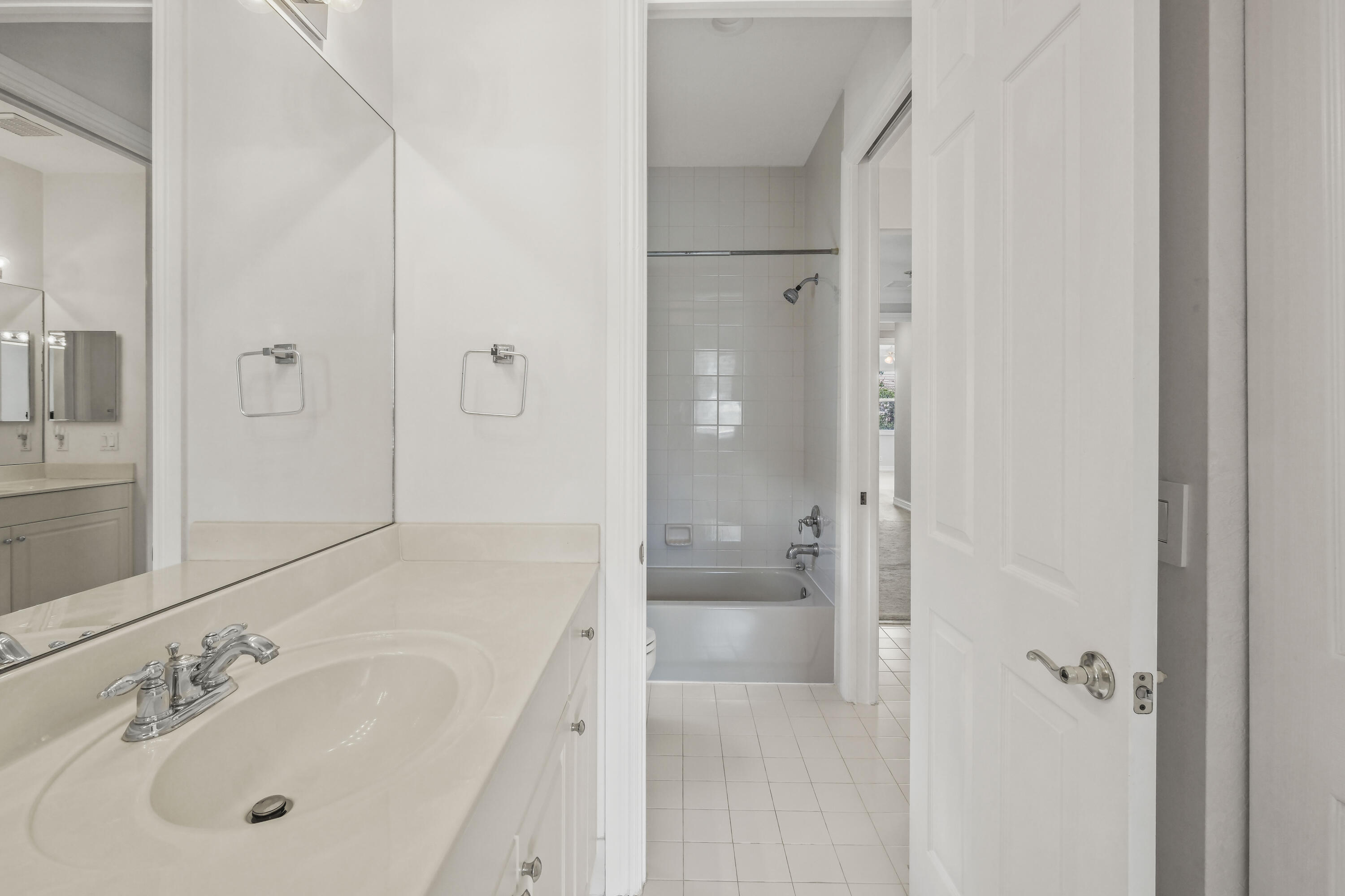 8620 Cobblestone Point Circle Boynton Beach, FL 33472 - Photo 29 of 42 a bathroom with a tub shower sink vanity and mirror