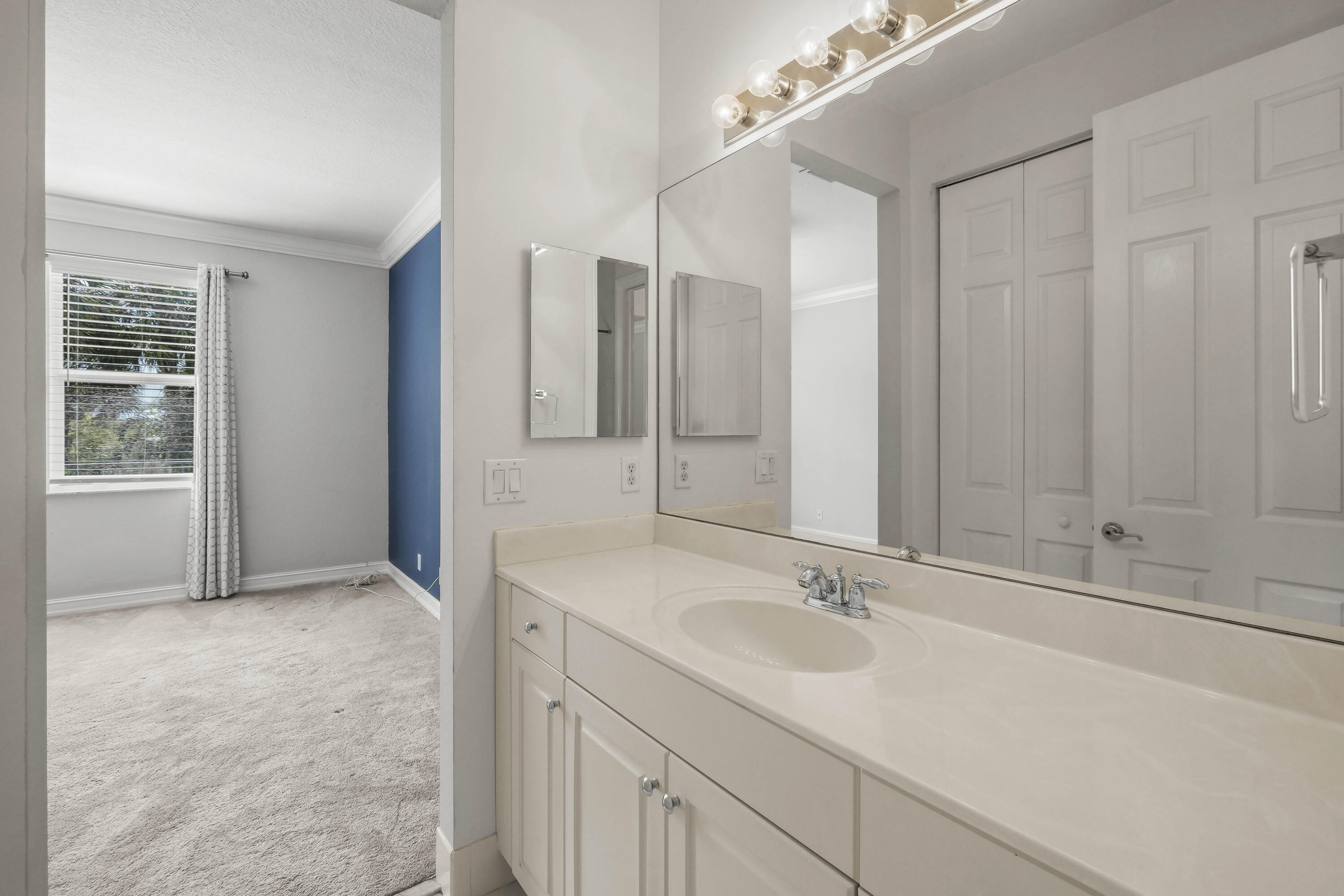 8620 Cobblestone Point Circle Boynton Beach, FL 33472 - Photo 31 of 42 a bathroom with a sink and a mirror