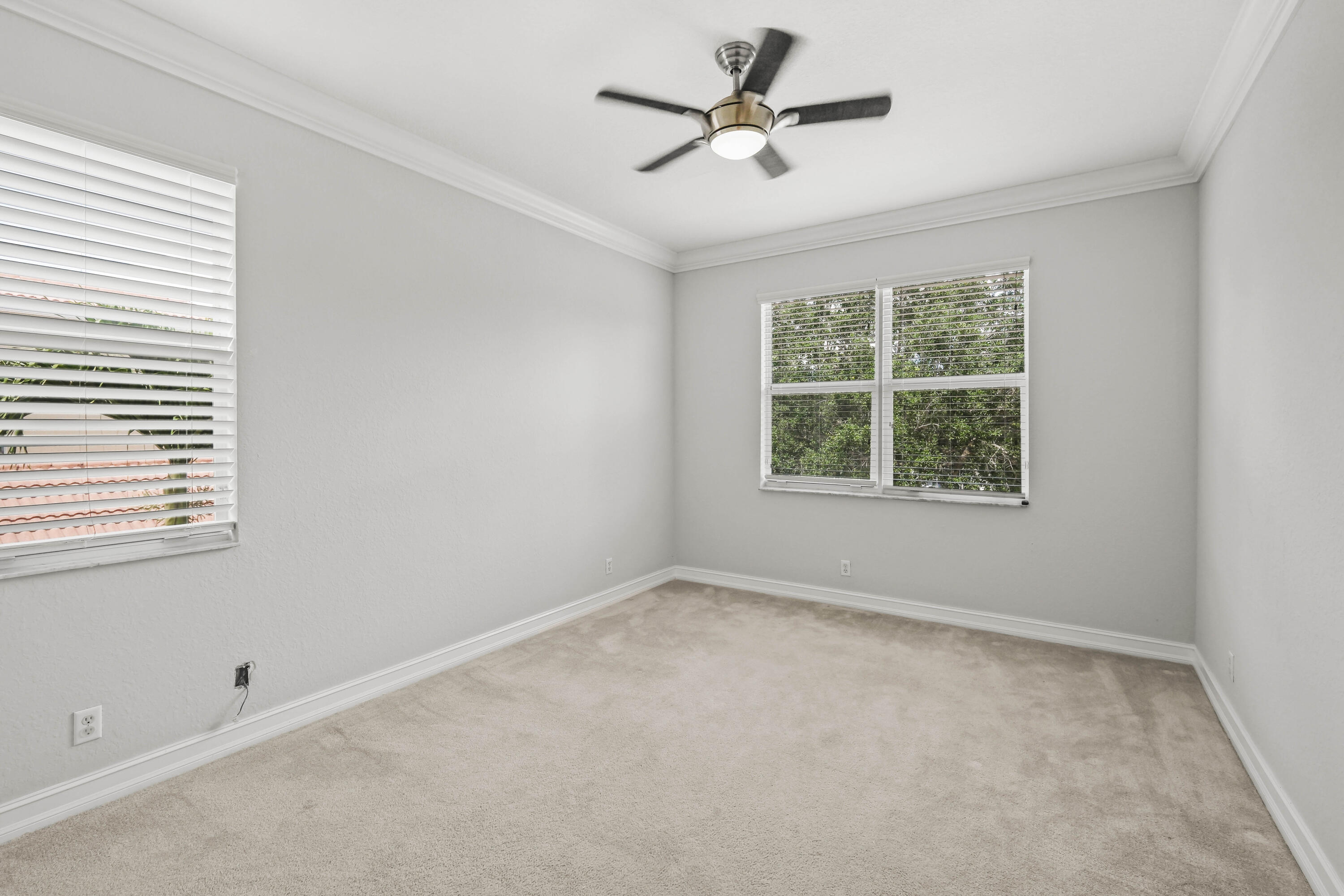8620 Cobblestone Point Circle Boynton Beach, FL 33472 - Photo 33 of 42 an empty room with a window and a fan