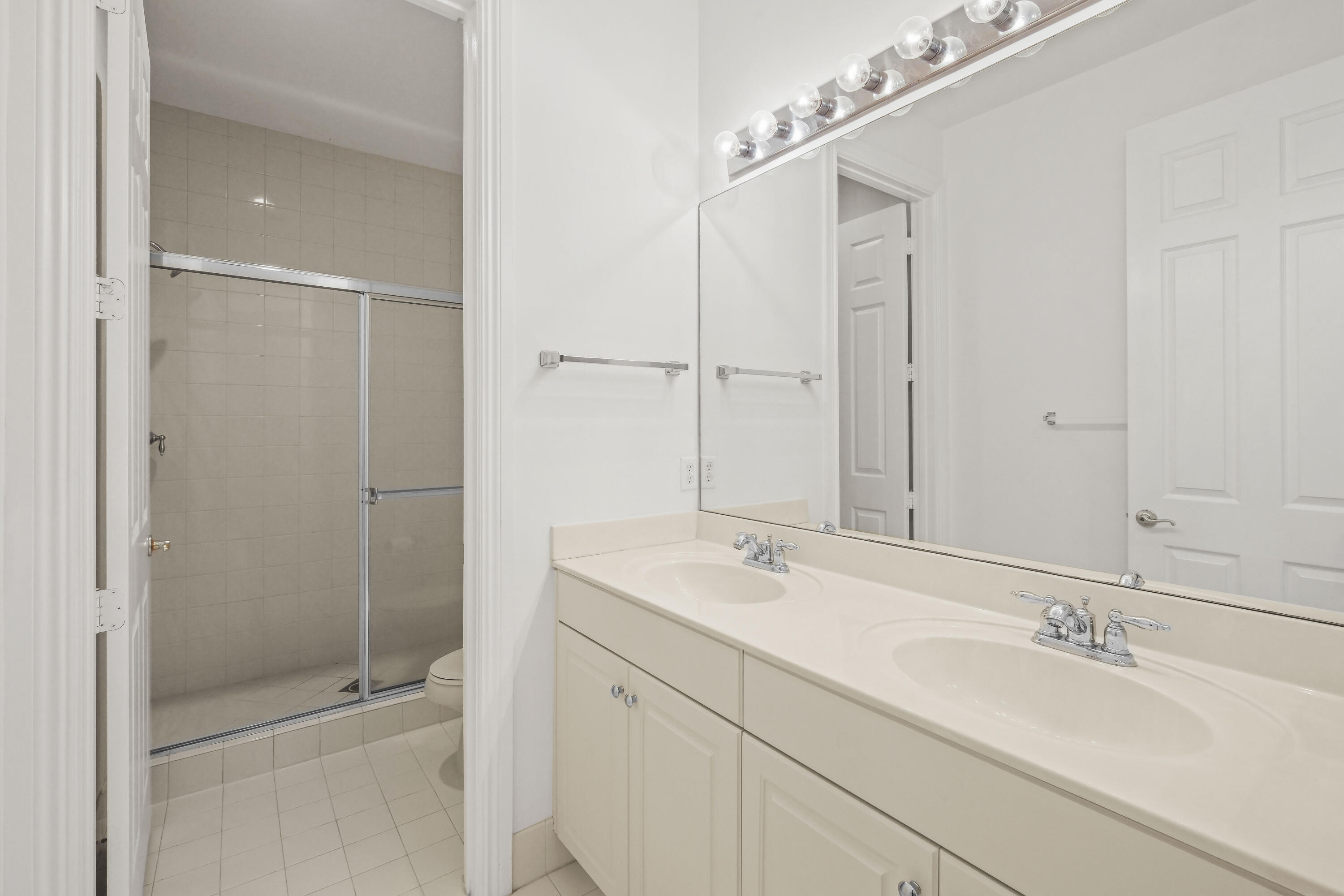 8620 Cobblestone Point Circle Boynton Beach, FL 33472 - Photo 35 of 42 a bathroom with a sink and a mirror