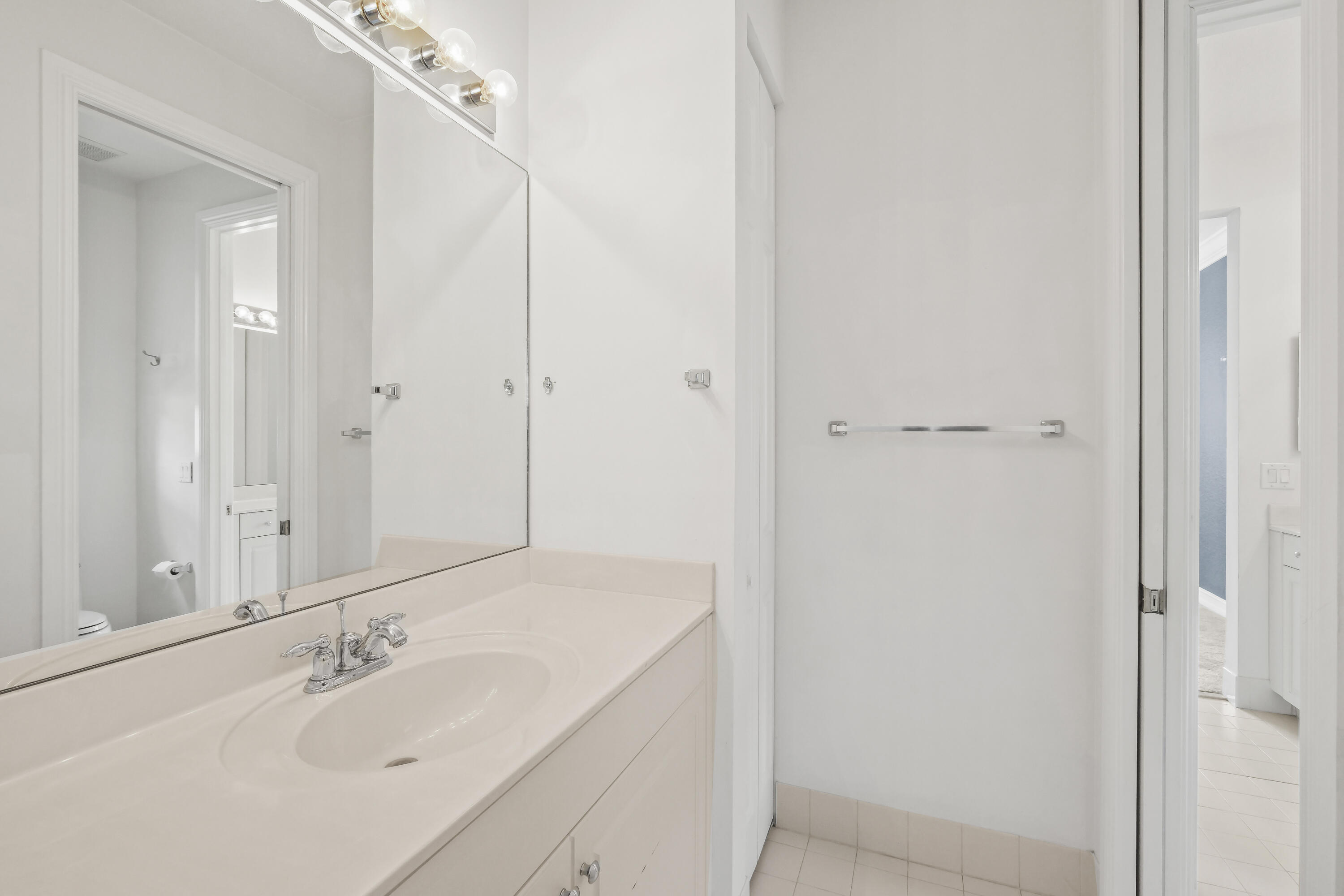 8620 Cobblestone Point Circle Boynton Beach, FL 33472 - Photo 37 of 42 a bathroom with a sink and a mirror