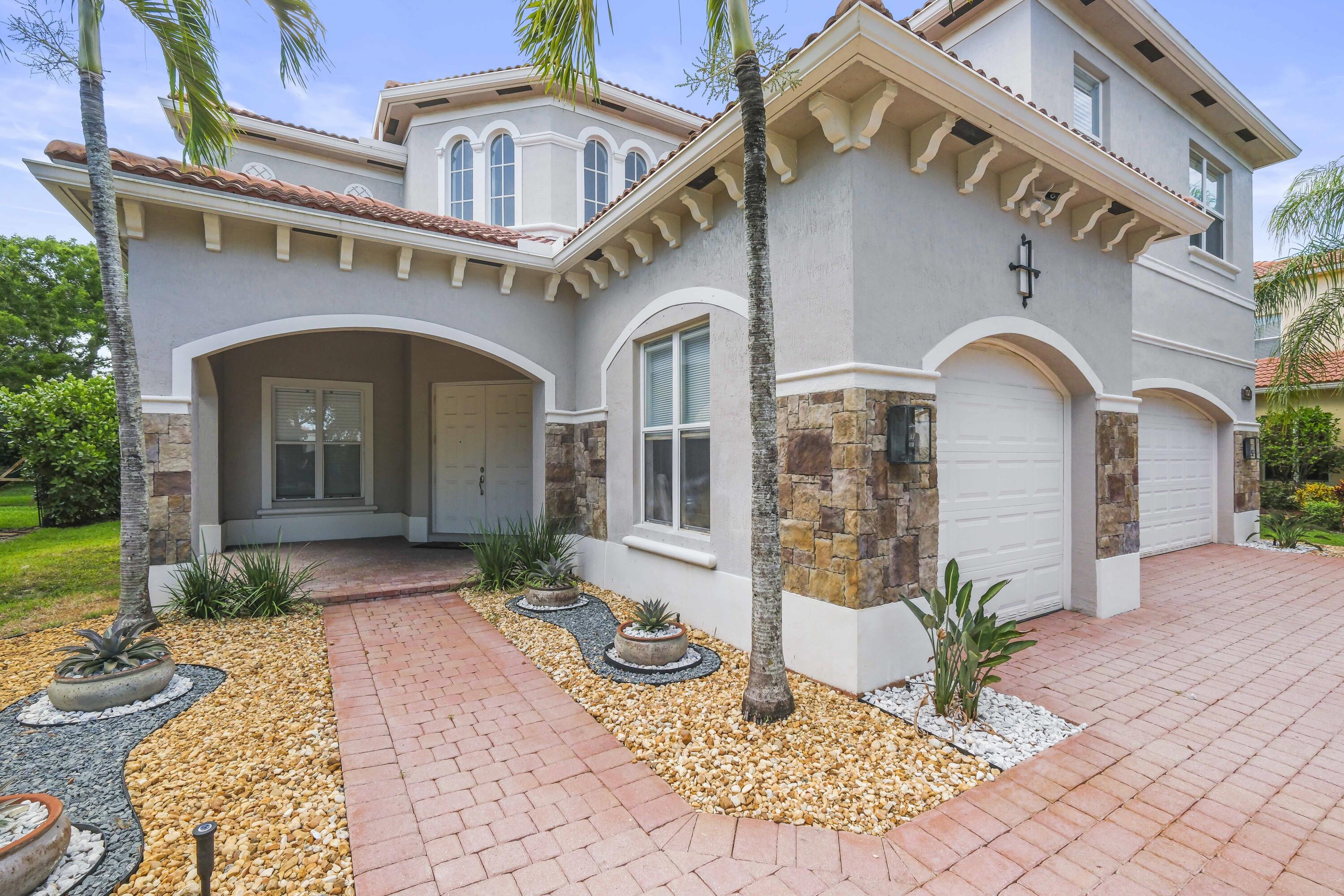 8620 Cobblestone Point Circle Boynton Beach, FL 33472 - Photo 4 of 42 a front view of a house