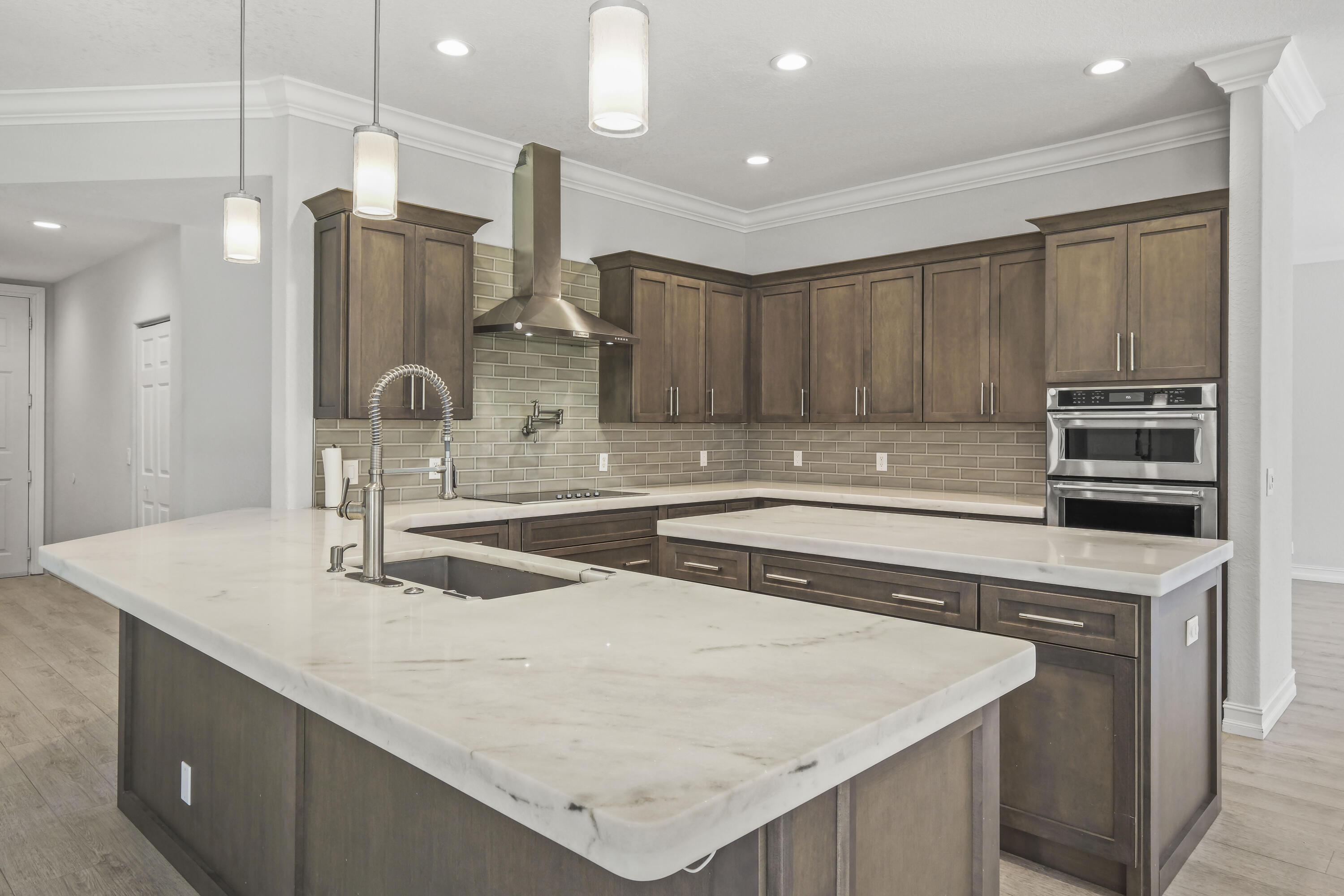 8620 Cobblestone Point Circle Boynton Beach, FL 33472 - Photo 9 of 42 a kitchen with stainless steel appliances granite countertop a sink a stove a refrigerator and island
