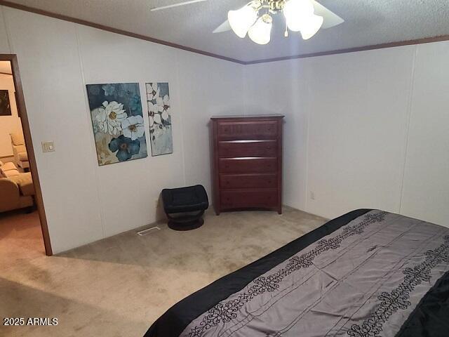 301 South Signal Butte Road, Unit 3 Apache Junction, AZ 85120 - Photo 12 of 34 a bedroom with a bed and a chandelier