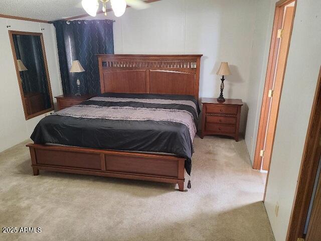 301 South Signal Butte Road, Unit 3 Apache Junction, AZ 85120 - Photo 13 of 34 a bedroom with a bed and wooden floor