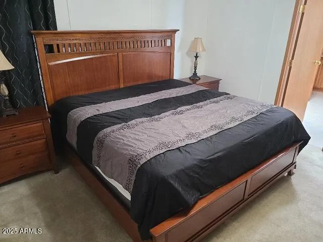 a bedroom with a bed and dresser