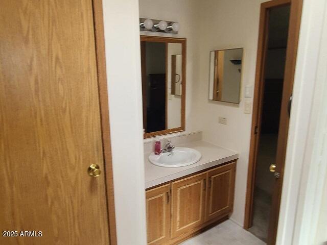 301 South Signal Butte Road, Unit 3 Apache Junction, AZ 85120 - Photo 17 of 34 a bathroom with a sink and a mirror