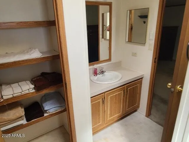 a bathroom with a glass shower door