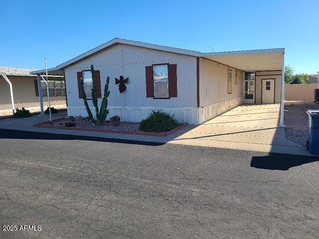 301 South Signal Butte Road, Unit 3 Apache Junction, AZ 85120 - Photo 28 of 34 a front view of a house with a yard