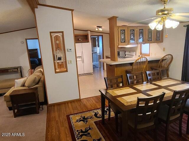 301 South Signal Butte Road, Unit 3 Apache Junction, AZ 85120 - Photo 5 of 34 a view of a dining room with furniture and wooden floor