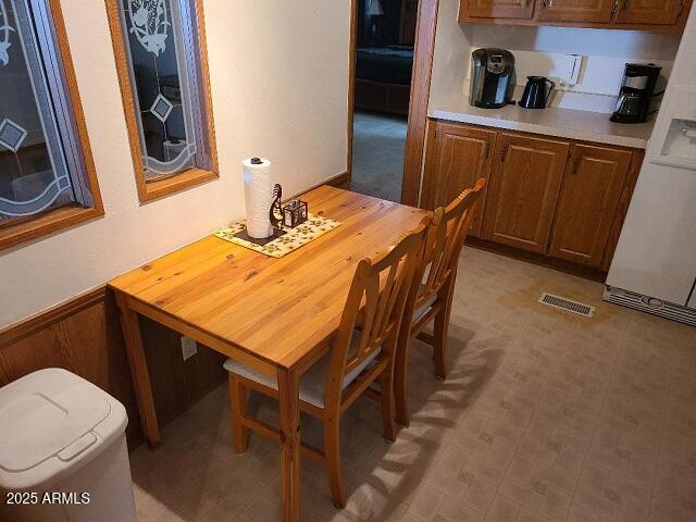 301 South Signal Butte Road, Unit 3 Apache Junction, AZ 85120 - Photo 7 of 34 a room with table chairs and a refrigerator