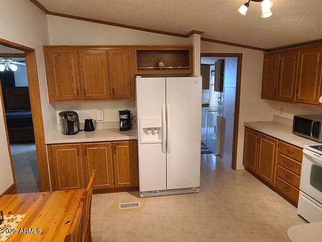 301 South Signal Butte Road, Unit 3 Apache Junction, AZ 85120 - Photo 9 of 34 a kitchen with stainless steel appliances a refrigerator and cabinets