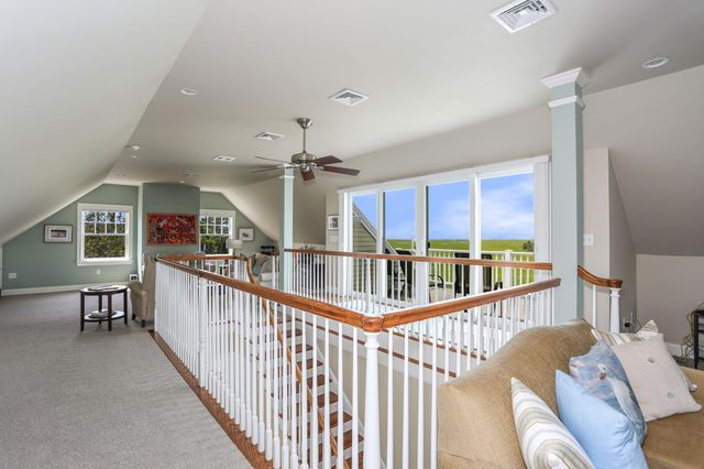 a view of a hallway with windows