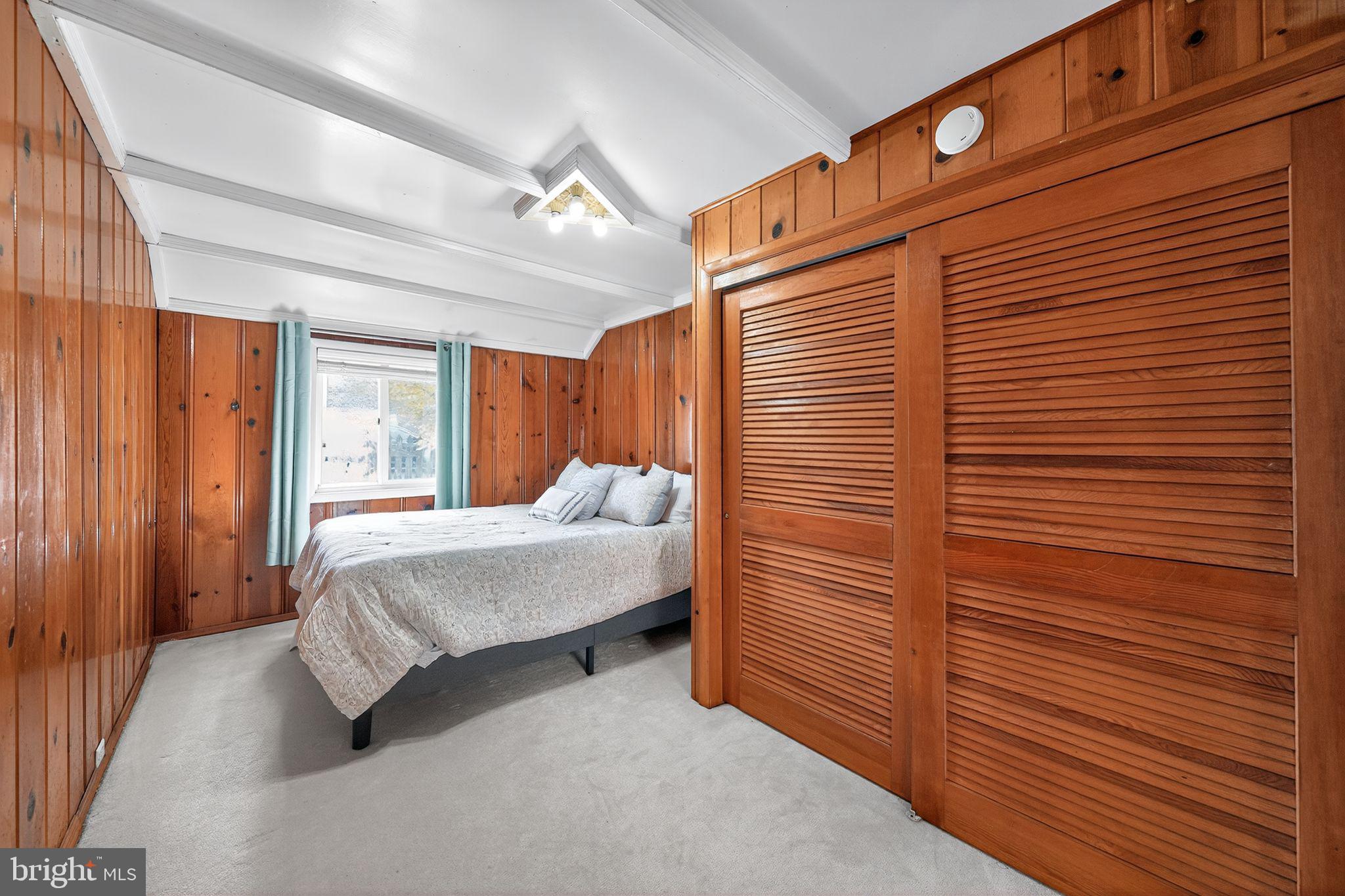 7523 B Street Chesapeake Beach, MD 20732 - Photo 13 of 29 a bedroom with a bed and wooden floor