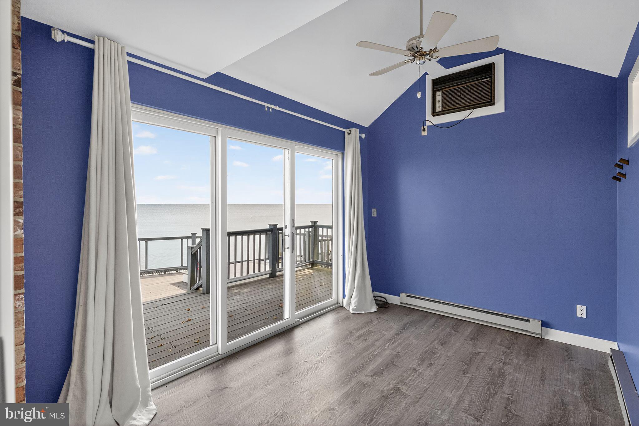 7523 B Street Chesapeake Beach, MD 20732 - Photo 20 of 29 an empty room with windows