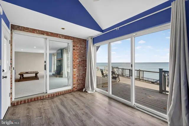 a view of a hardwood floor and an empty room