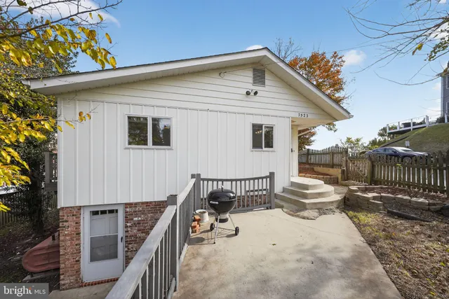 a backyard of a house with seating space