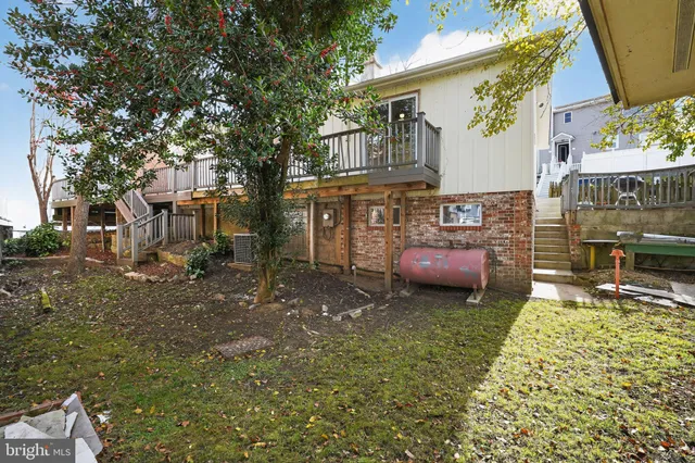 a couple of cars parked in front of a house