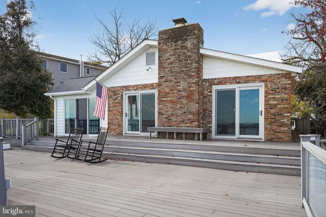 a front view of a house with seating space