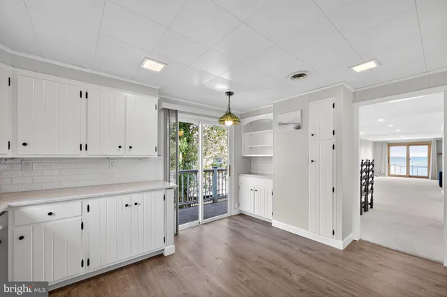 a view of a kitchen with wooden floors