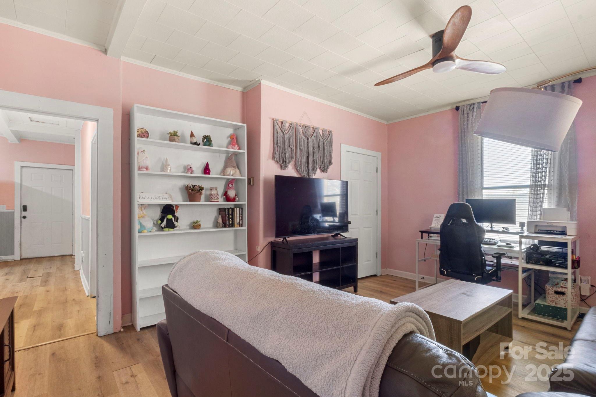 204 Shelby Street Hickory, NC 28601 - Photo 13 of 22 a living room with stainless steel appliances furniture a rug and a view of kitchen