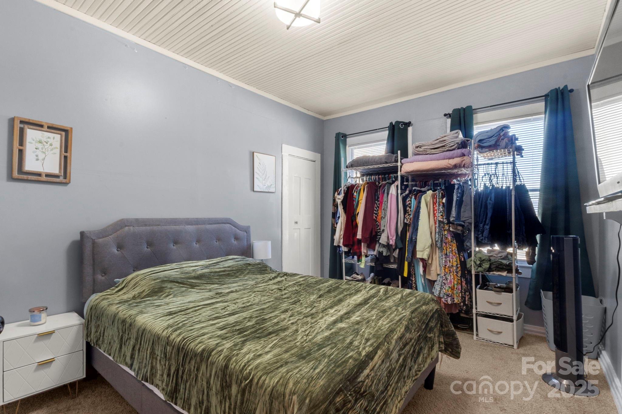 204 Shelby Street Hickory, NC 28601 - Photo 14 of 22 a bedroom with a bed and a closet