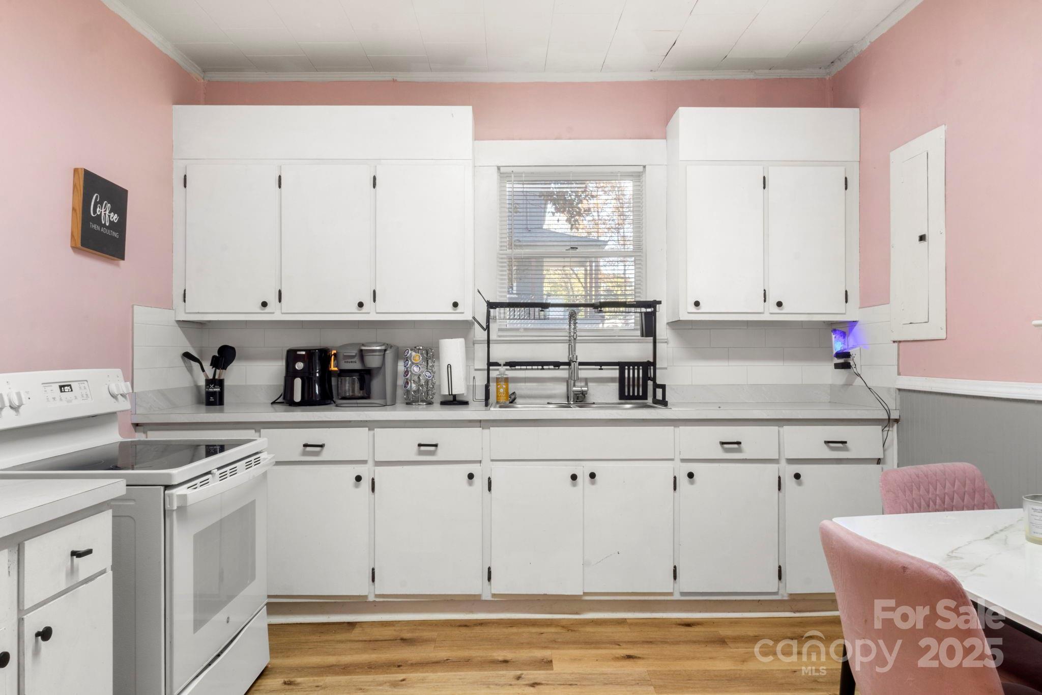 204 Shelby Street Hickory, NC 28601 - Photo 19 of 22 a kitchen with stainless steel appliances granite countertop a sink and cabinets