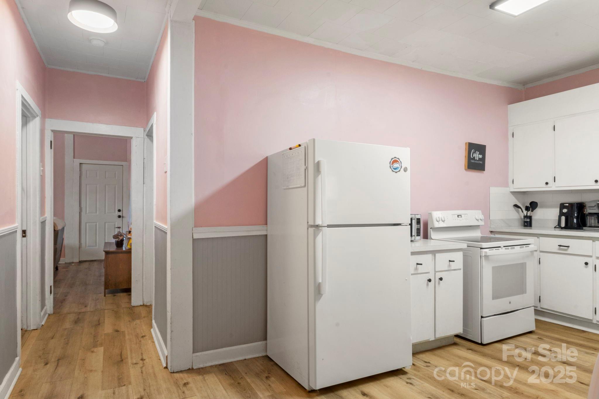 204 Shelby Street Hickory, NC 28601 - Photo 20 of 22 a white refrigerator freezer sitting inside of a kitchen