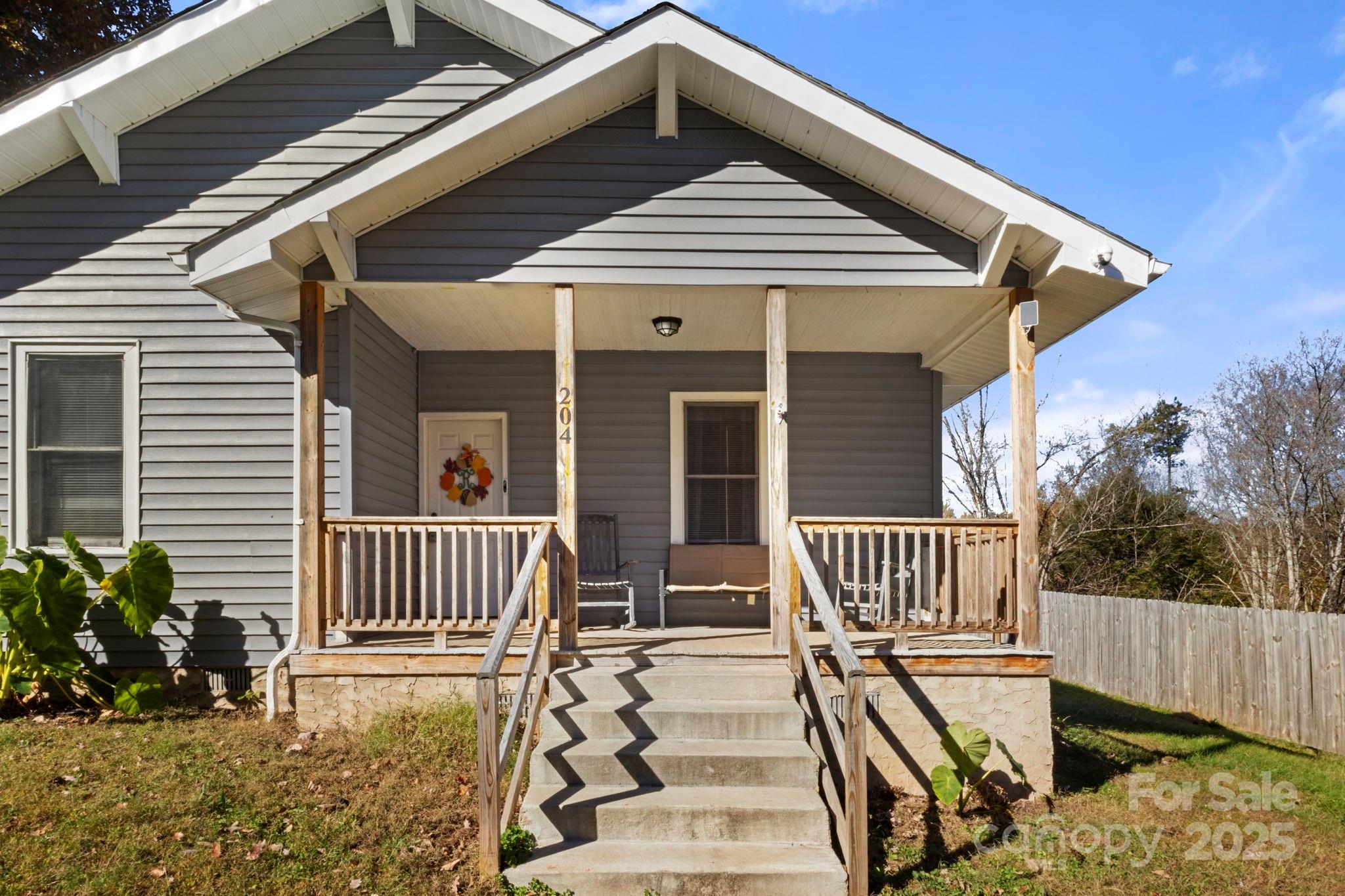 204 Shelby Street Hickory, NC 28601 - Photo 2 of 22 a front view of a house with garden and porch