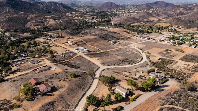 an aerial view of a house with a lot of trees