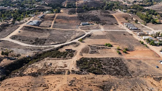 an aerial view of residential houses and outdoor space