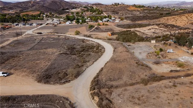 an aerial view of residential houses with city view