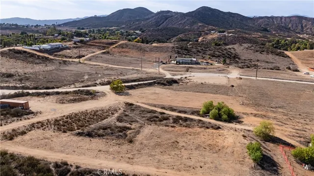 a view of a town with mountains in the background