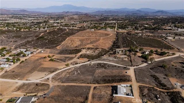 an aerial view of residential house and sandy dunes