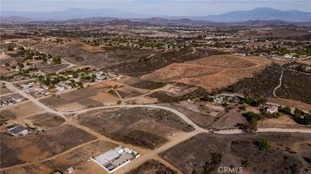 an aerial view of residential house and outdoor space
