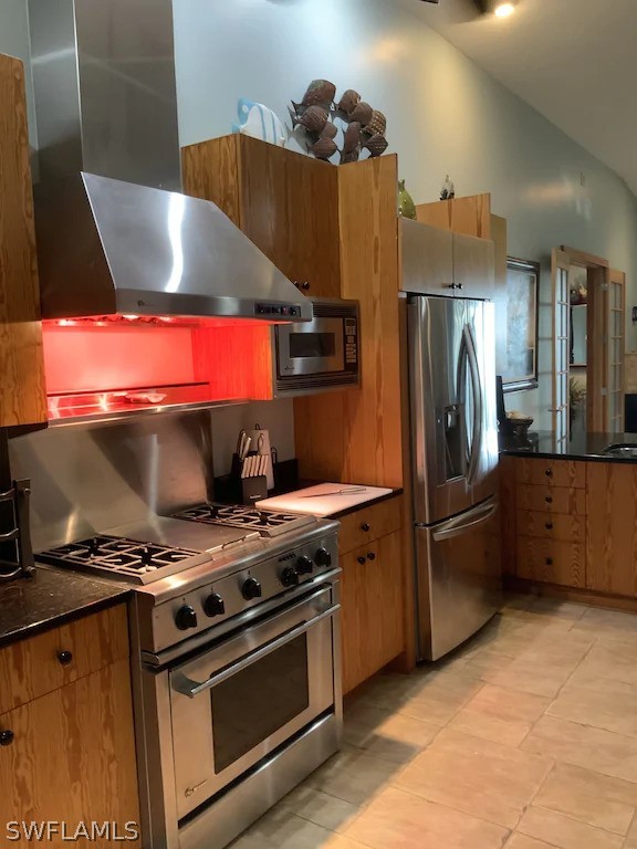 7231 Pineland Road Bokeelia, FL 33922 - Photo 11 of 24 a kitchen with stainless steel appliances granite countertop a stove and a refrigerator