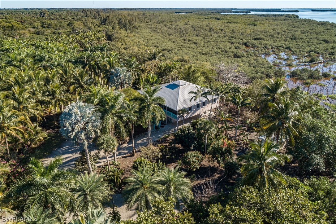 7231 Pineland Road Bokeelia, FL 33922 - Photo 2 of 24 a view of a houses with a lake
