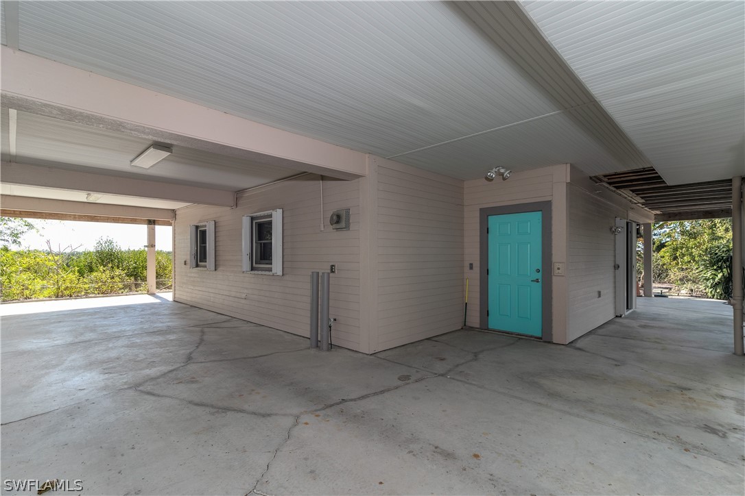 7231 Pineland Road Bokeelia, FL 33922 - Photo 24 of 24 a view of a livingroom with an empty space and a window