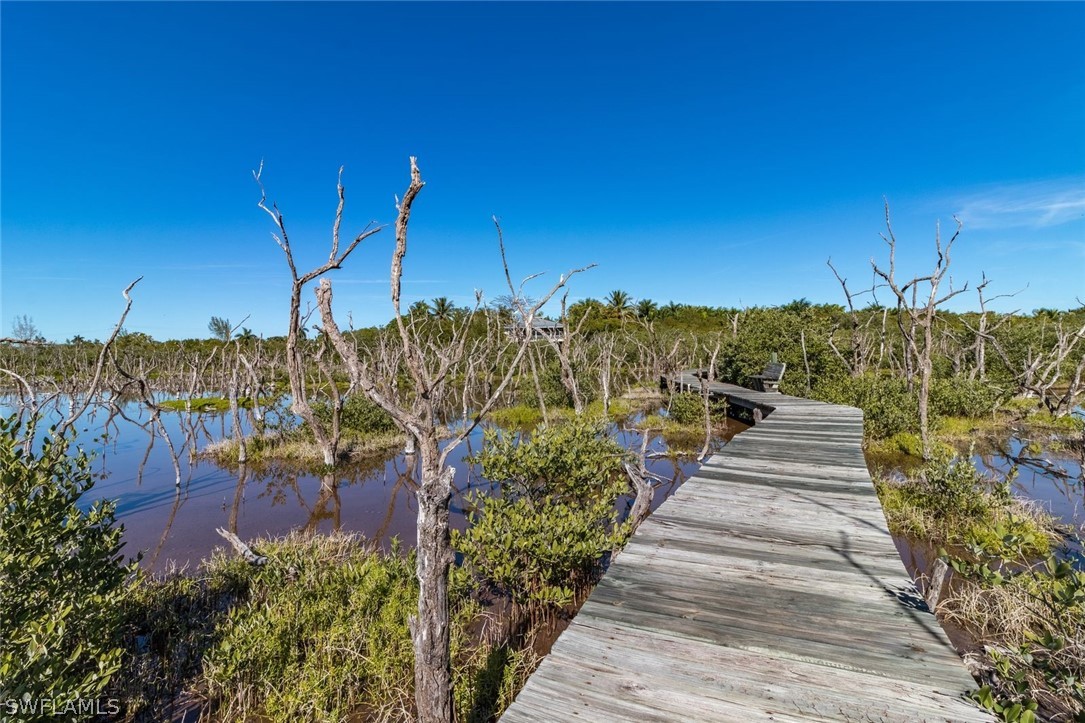 7231 Pineland Road Bokeelia, FL 33922 - Photo 3 of 24 a view of a house with a yard